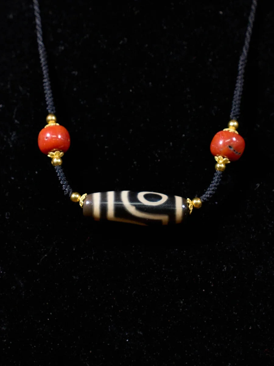 Ancient Clearing · Two-Eyed Dzi & Coral Necklace
