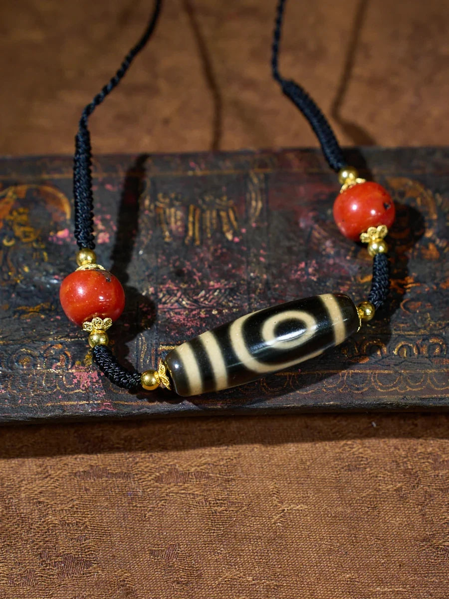 Ancient Clearing · Two-Eyed Dzi & Coral Necklace